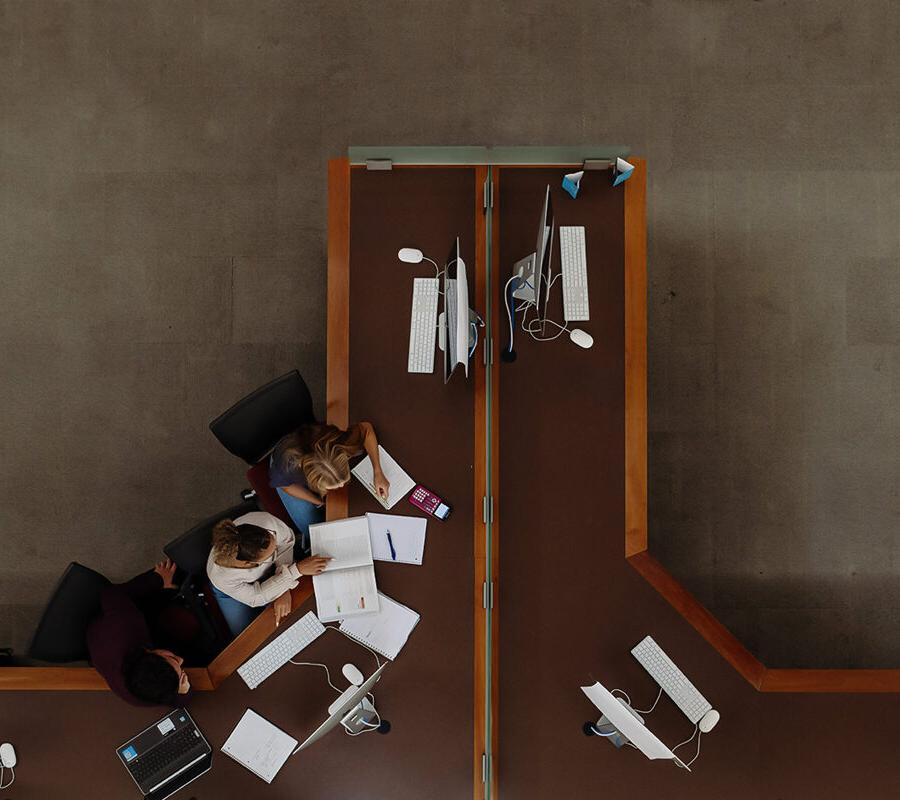 Bird's eye view of students studying in the library.